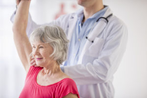 Senior women in physical therapy session